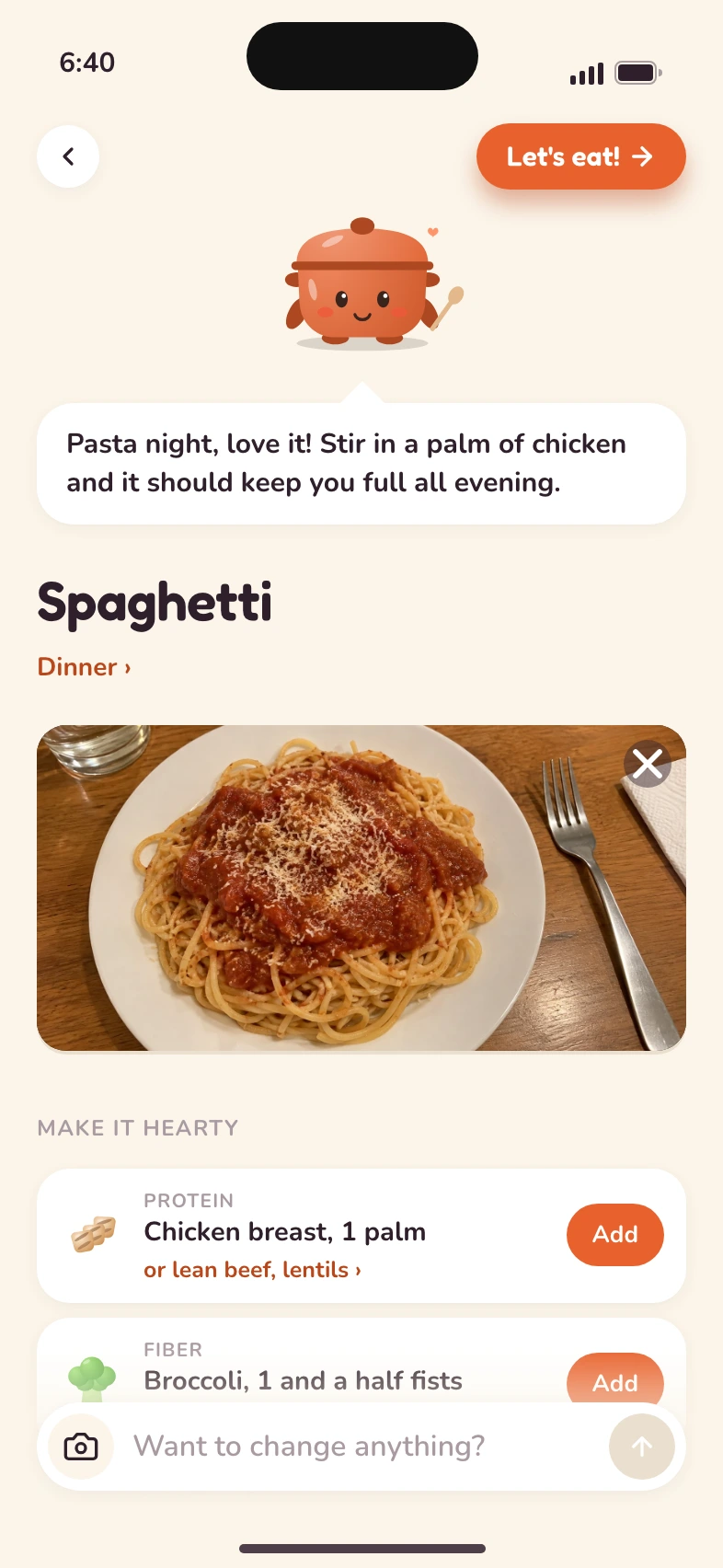Hearty looking at a photo of spaghetti and suggesting a palm of chicken